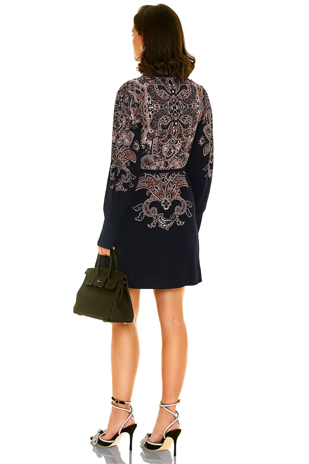 Back view of navy floral long sleeve mini dress with ornate print