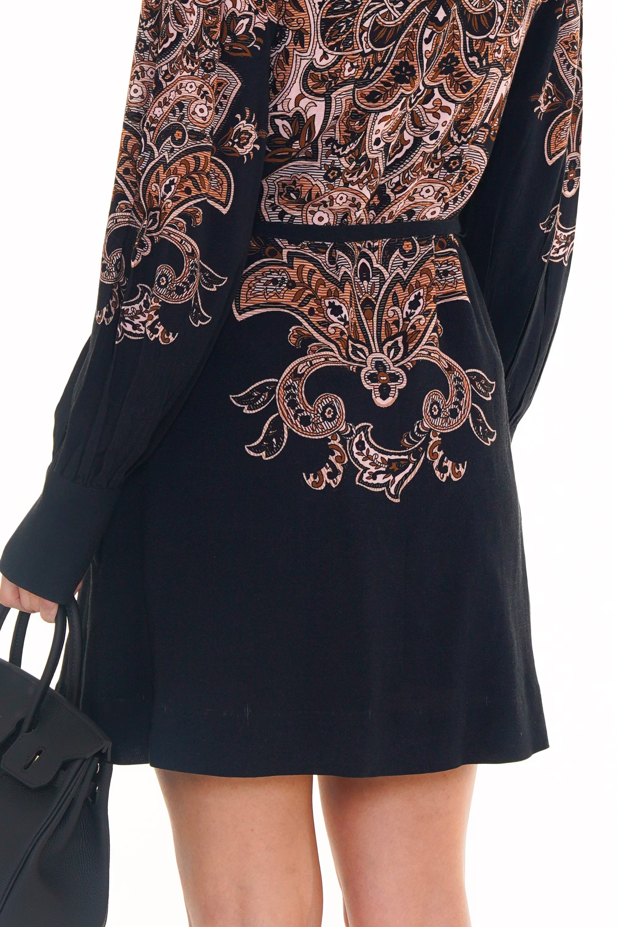 Back closeup of navy ornate mini dress with intricate print design