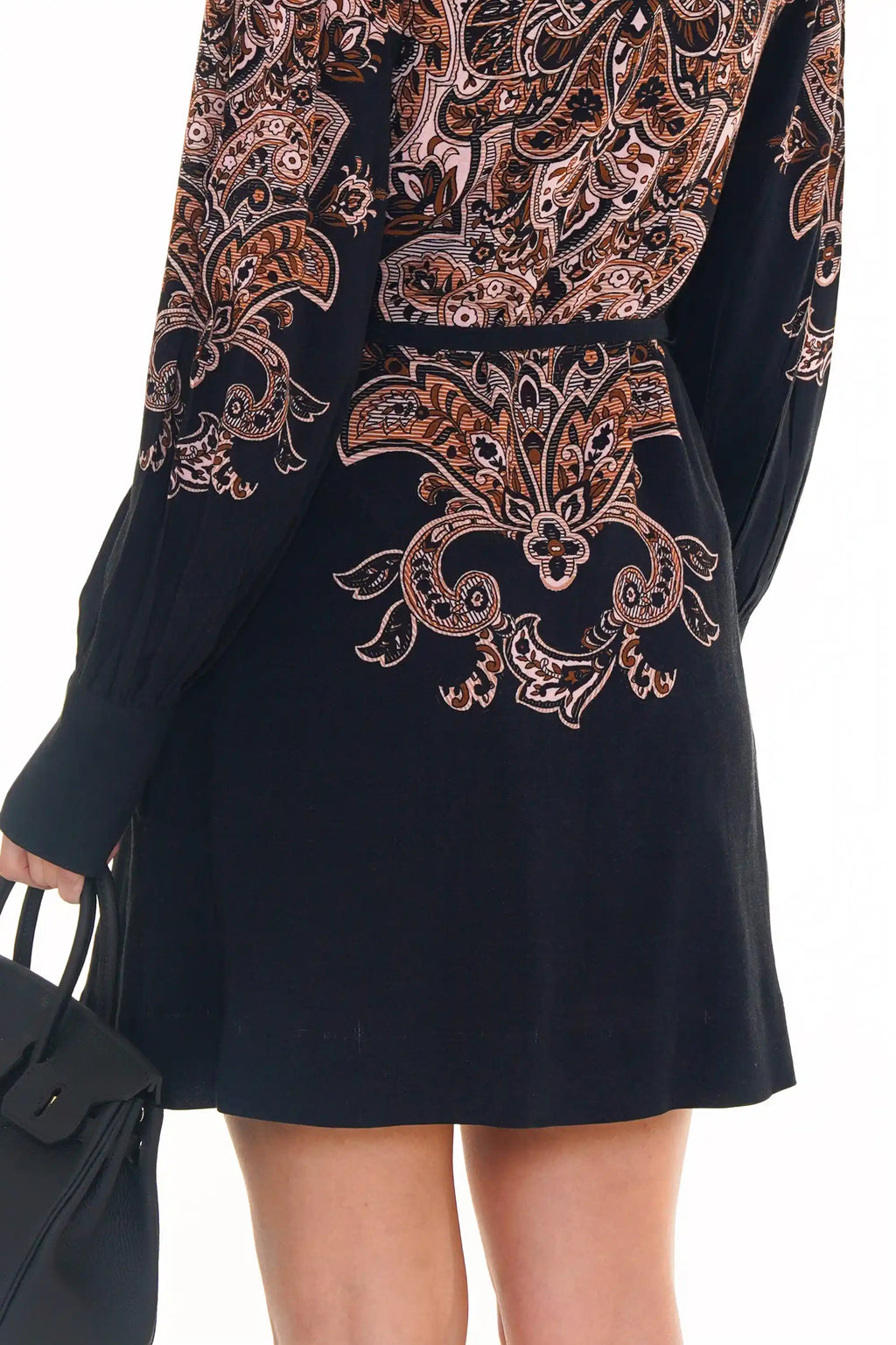 Back view of navy ornate printed mini dress with long sleeves