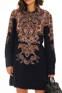 Front view of navy ornate printed mini dress with intricate floral details