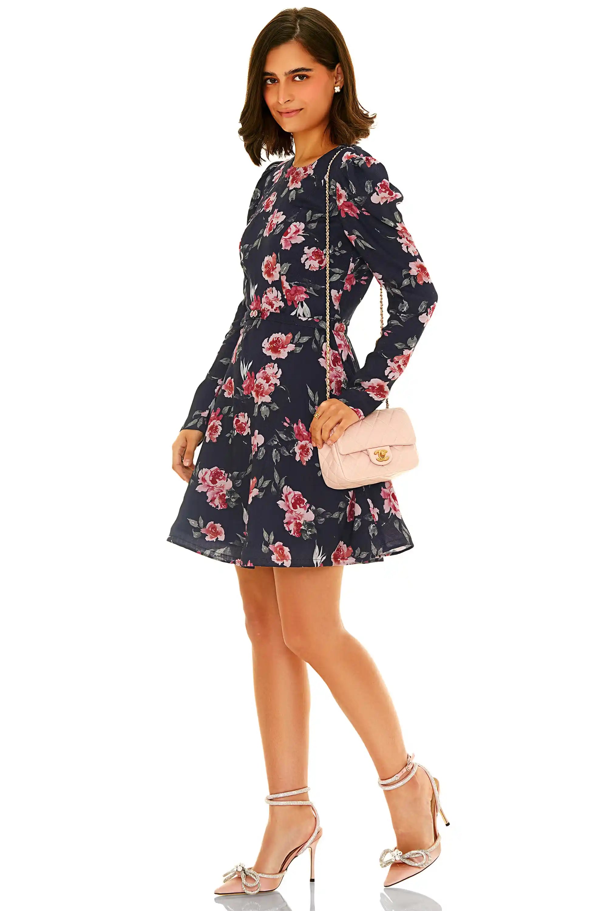Side view of navy rose print long sleeve mini dress