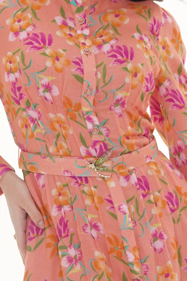 Close-up of Pretty Pixie orange floral mini dress