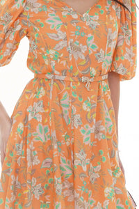 Close-up of Pretty Pixie orange floral mini dress, fabric detail