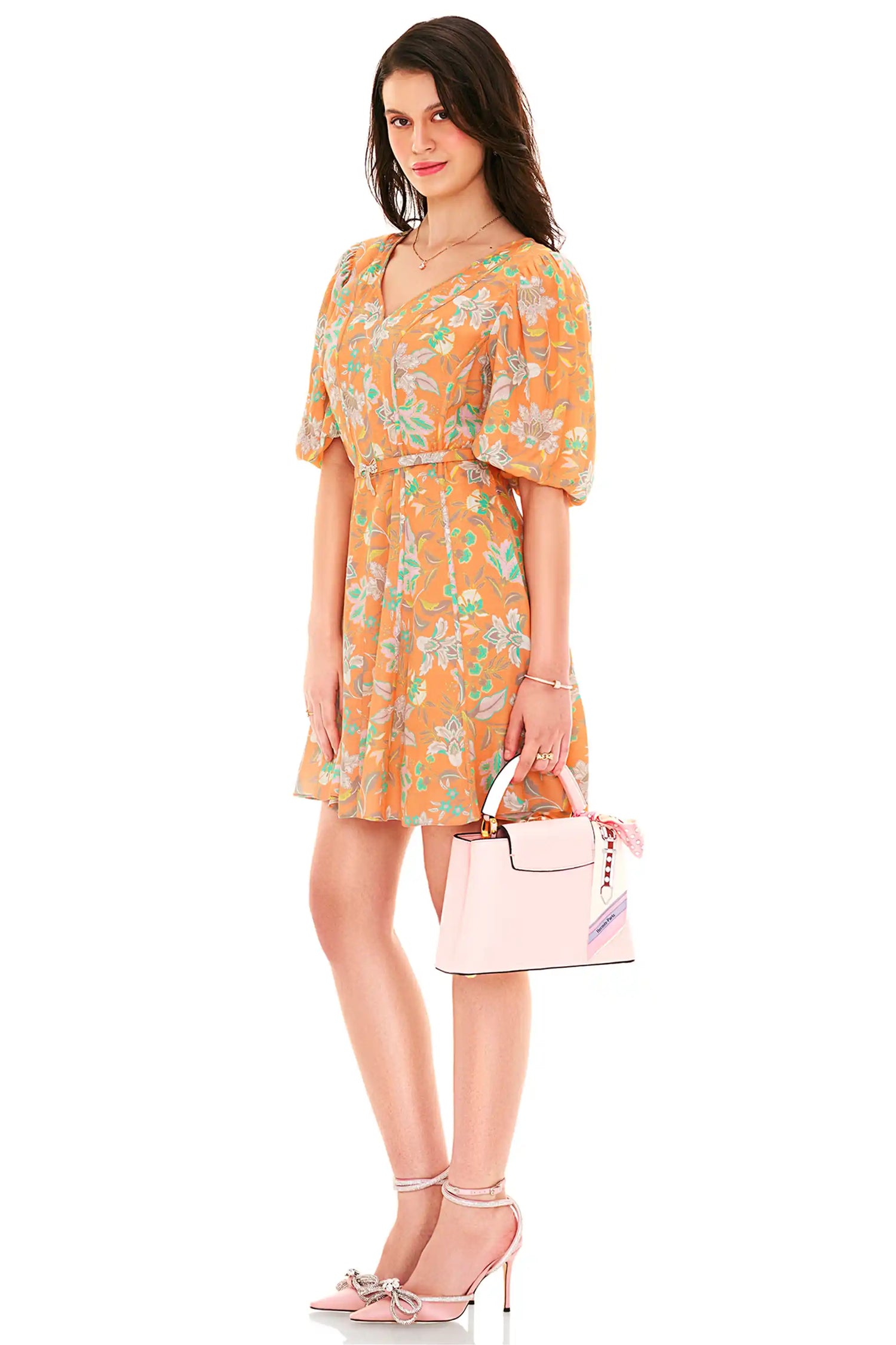 Side view of orange floral v-neck puff sleeve mini dress with belted waist – chic casual wear for women.