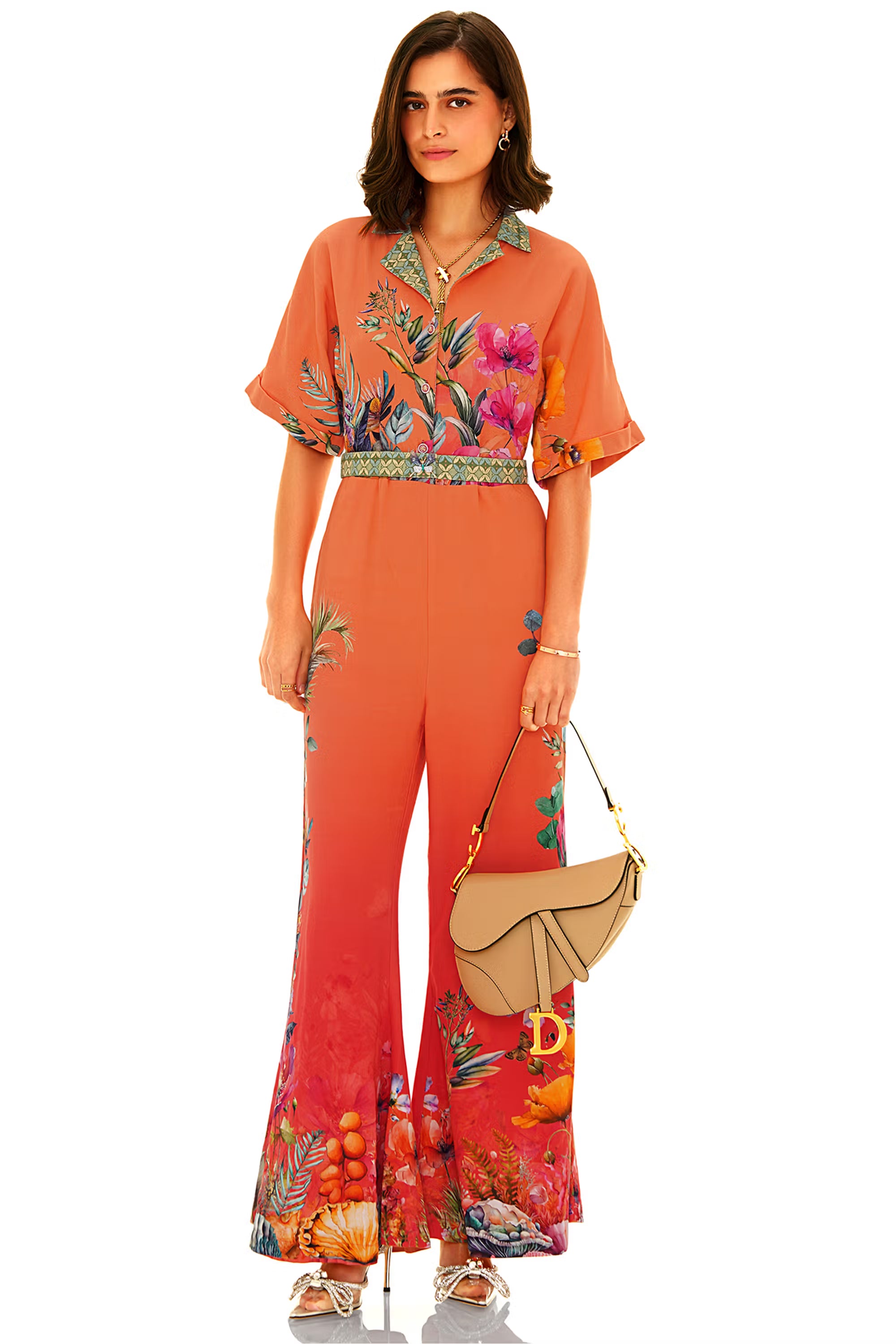 Woman in orange floral wide leg jumpsuit front view