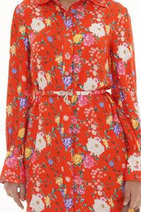 Close-up of Pretty Pixie orange multicolor floral belted collared shirt dress with crystal bow buckle