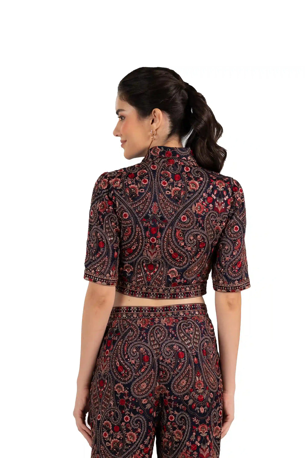 Back view of woman in paisley print crop top, Indian ethnic shirt blouse, with embroidery and short sleeves
