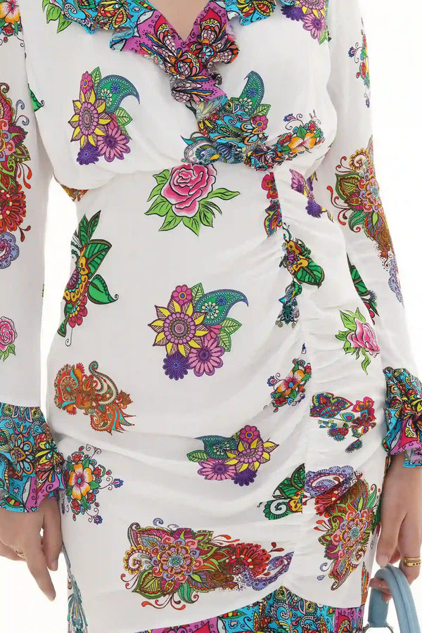 Close-up of Pretty Pixie pastel floral puff-sleeve mini dress