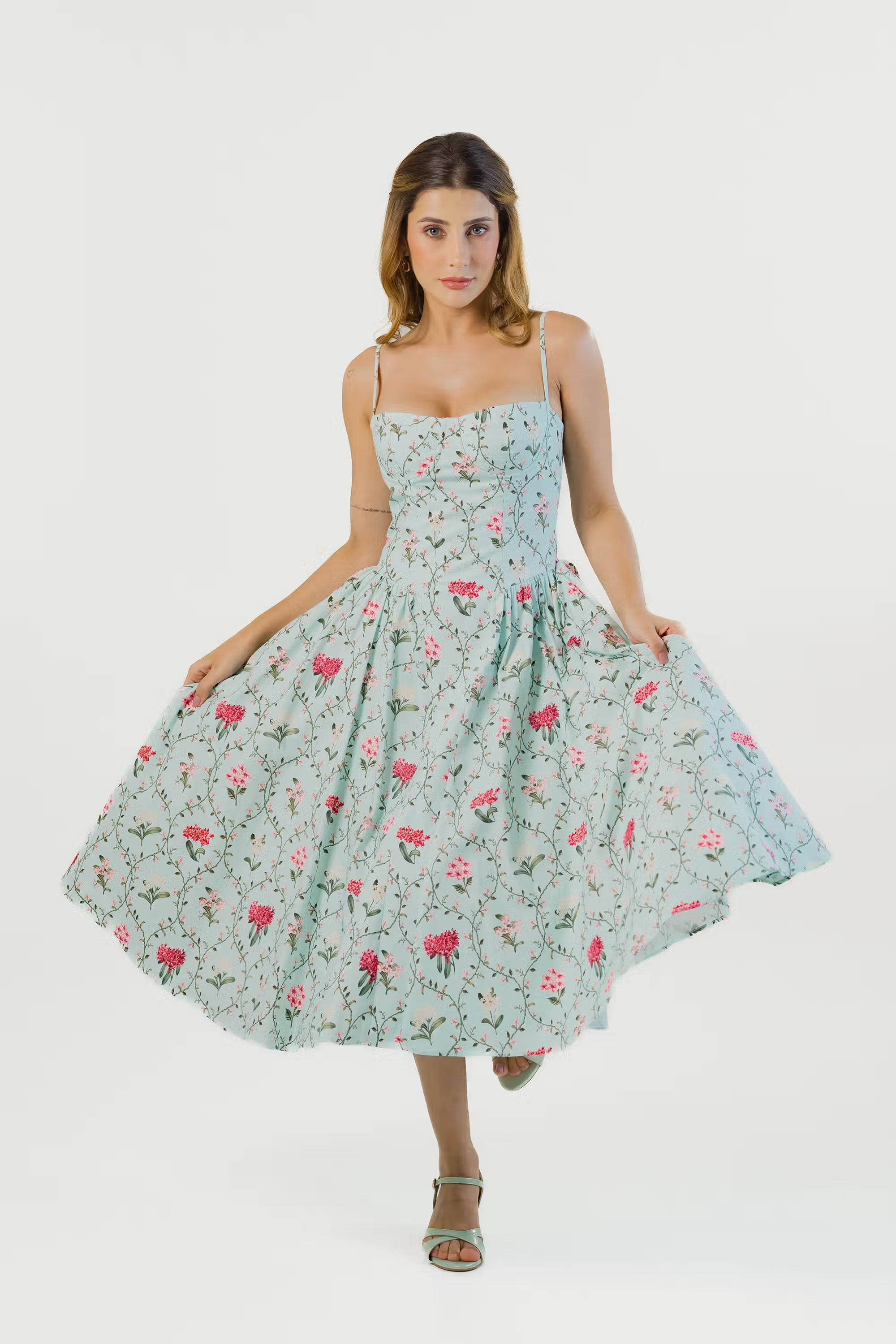 Pastel green floral midi dress, full front, flared skirt, pink floral print.