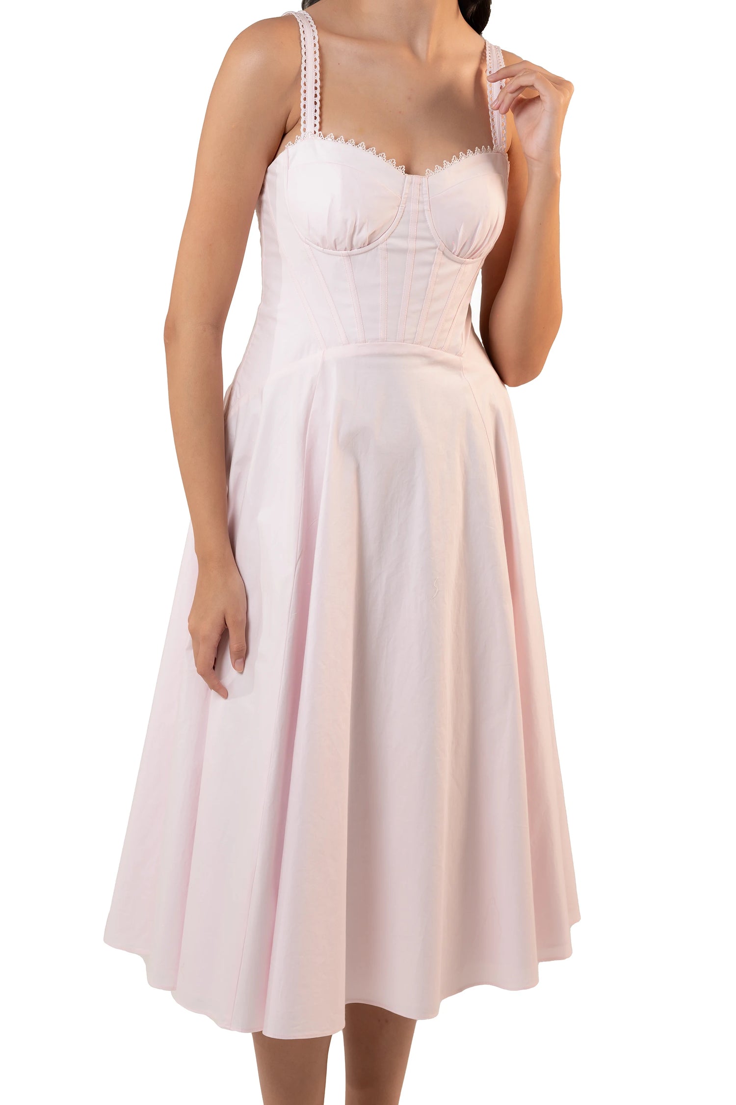 Close-up of pastel pink midi dress bustier bodice showing sweetheart cups, corset seaming and lace-trim straps