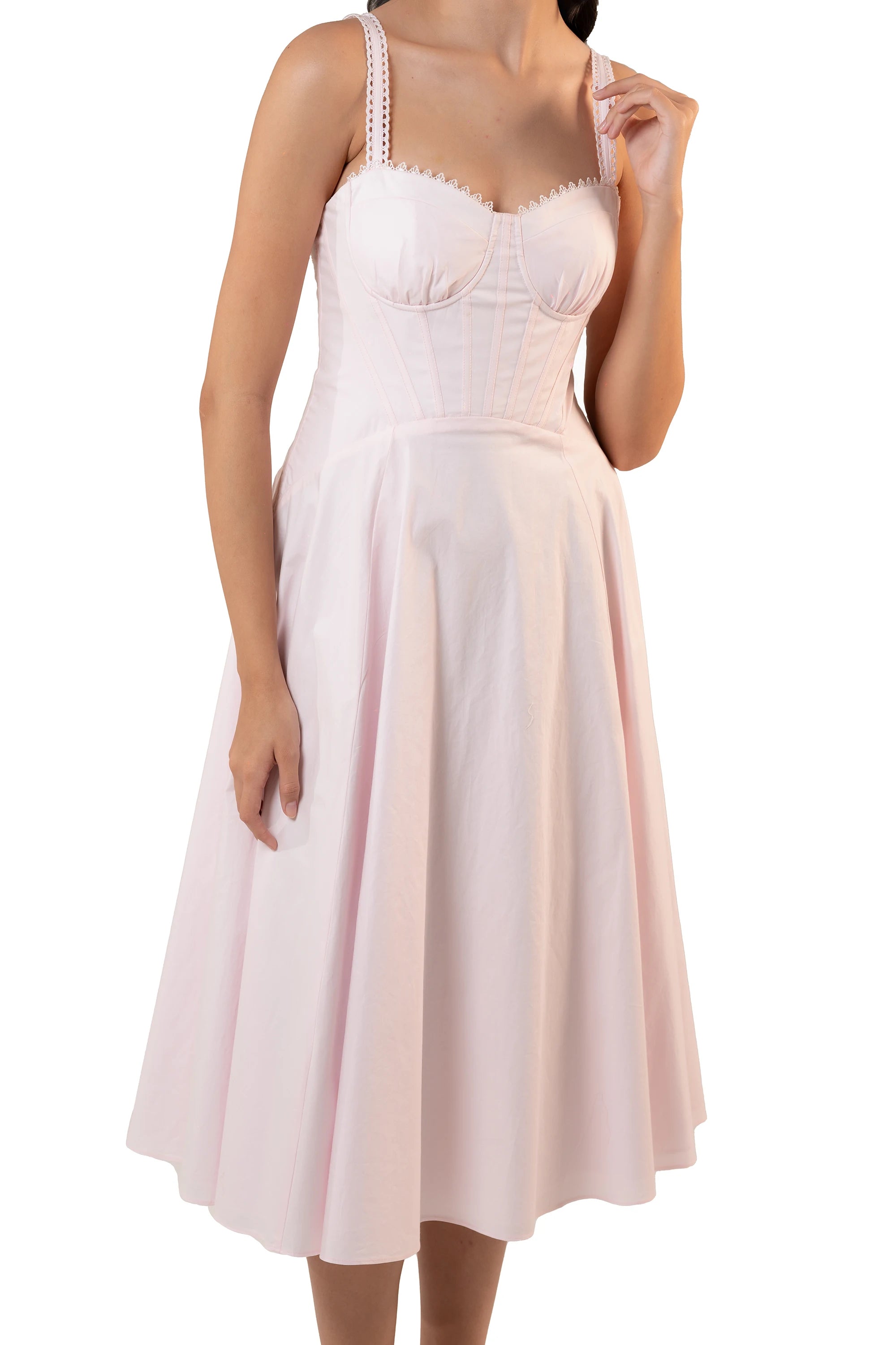 Close-up of pastel pink midi dress bustier bodice showing sweetheart cups, corset seaming and lace-trim straps