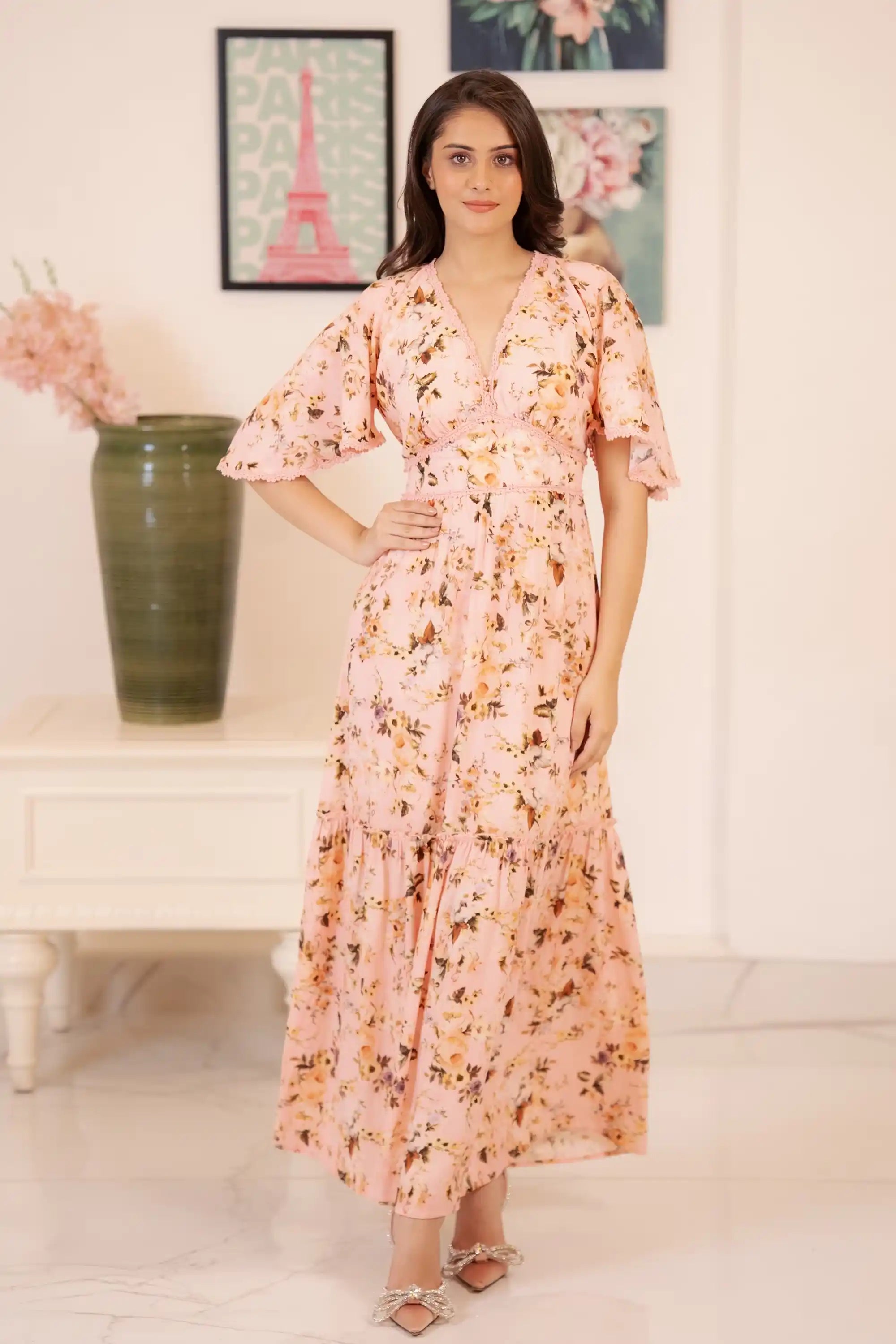 Full front view of peach pink floral maxi dress styled with heels