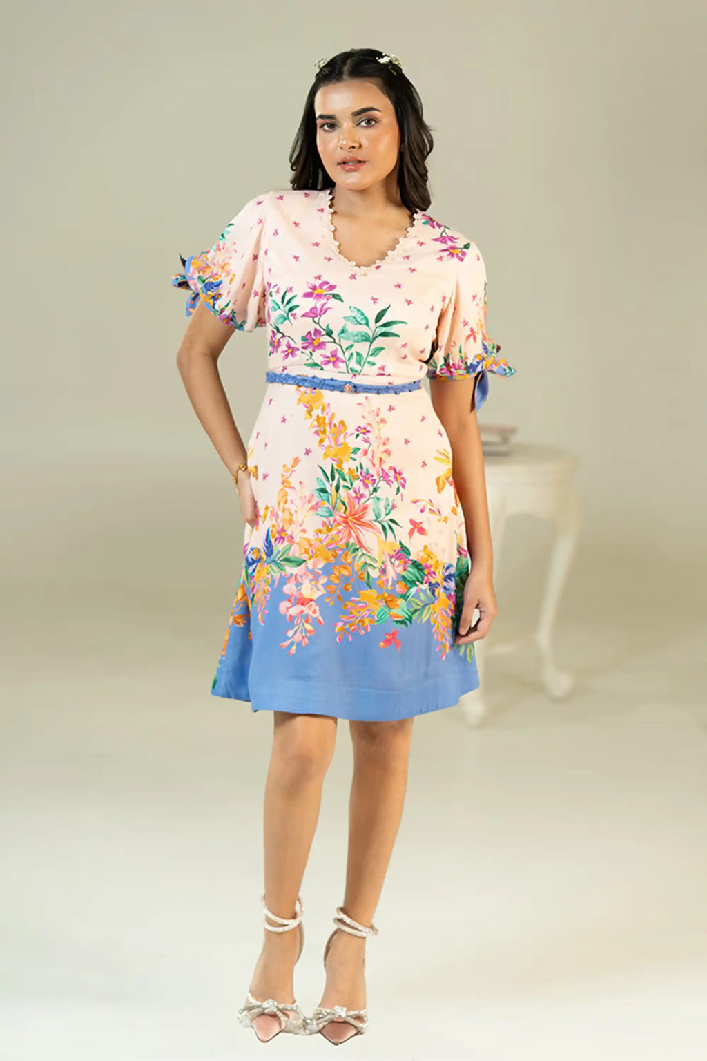 Pink and blue floral short dress with puff sleeves front pose