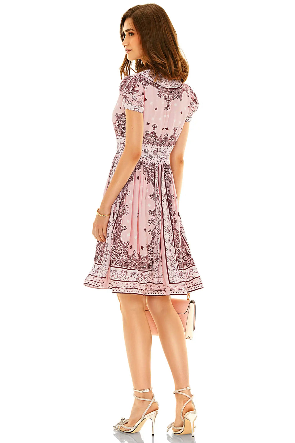 Back view of pink ethnic floral V-neck mini dress with intricate floral patterns