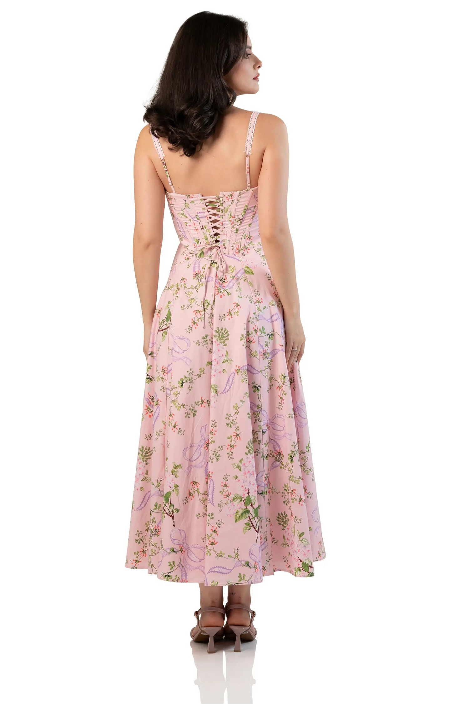 Back view of women’s pink floral corset midi dress with lace-up back and flared hem
