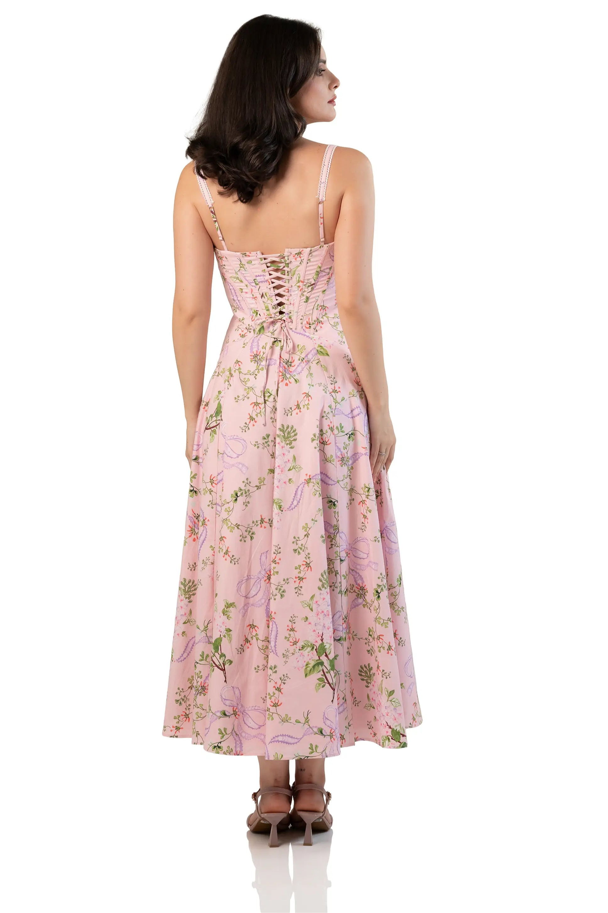Back view of women’s pink floral corset midi dress with lace-up back and flared hem