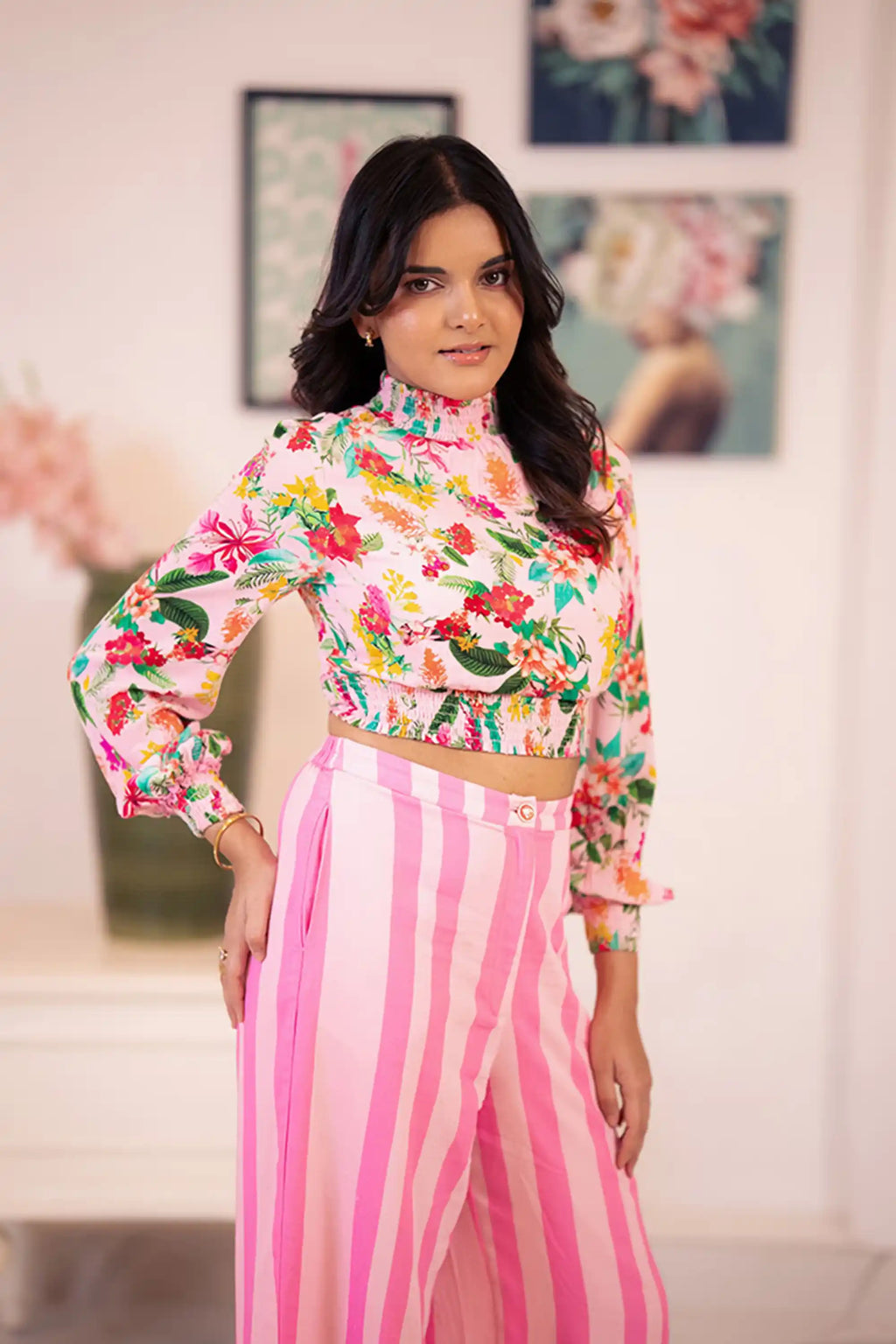 Pink floral crop top with pink striped pants side view