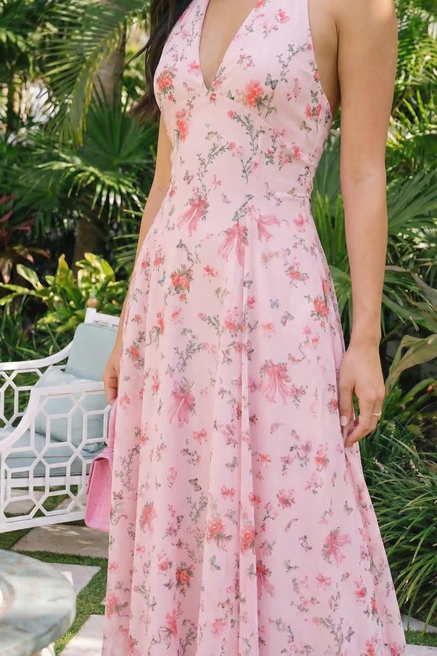 Pretty Pixie pink floral bow print halter v-neck midi dress side view flowy a-line hem