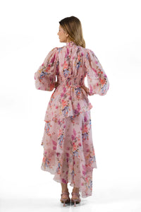 Back view: pink floral tiered maxi dress with smocked waist and ruffle cuffs
