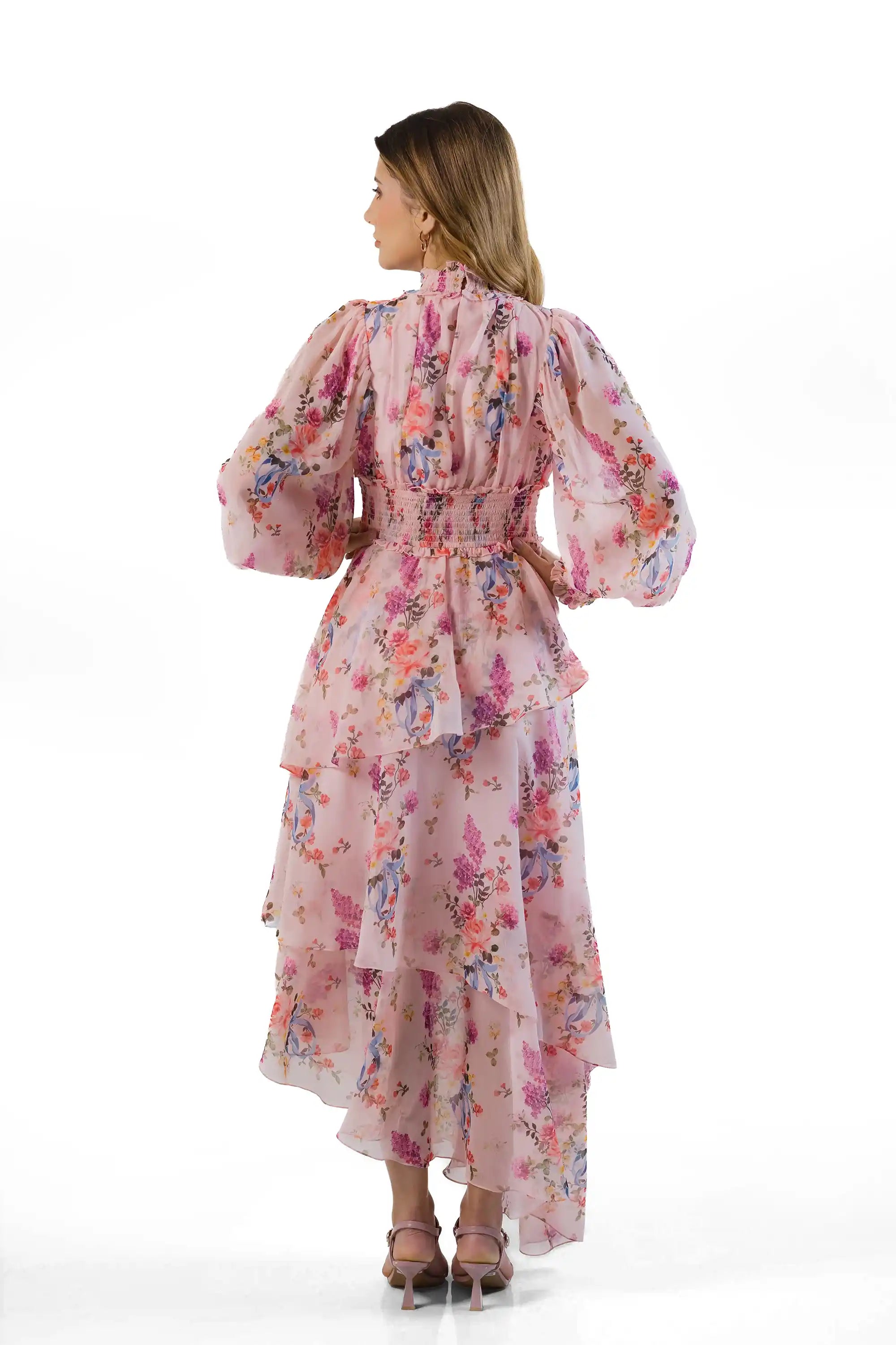 Back view: pink floral tiered maxi dress with smocked waist and ruffle cuffs
