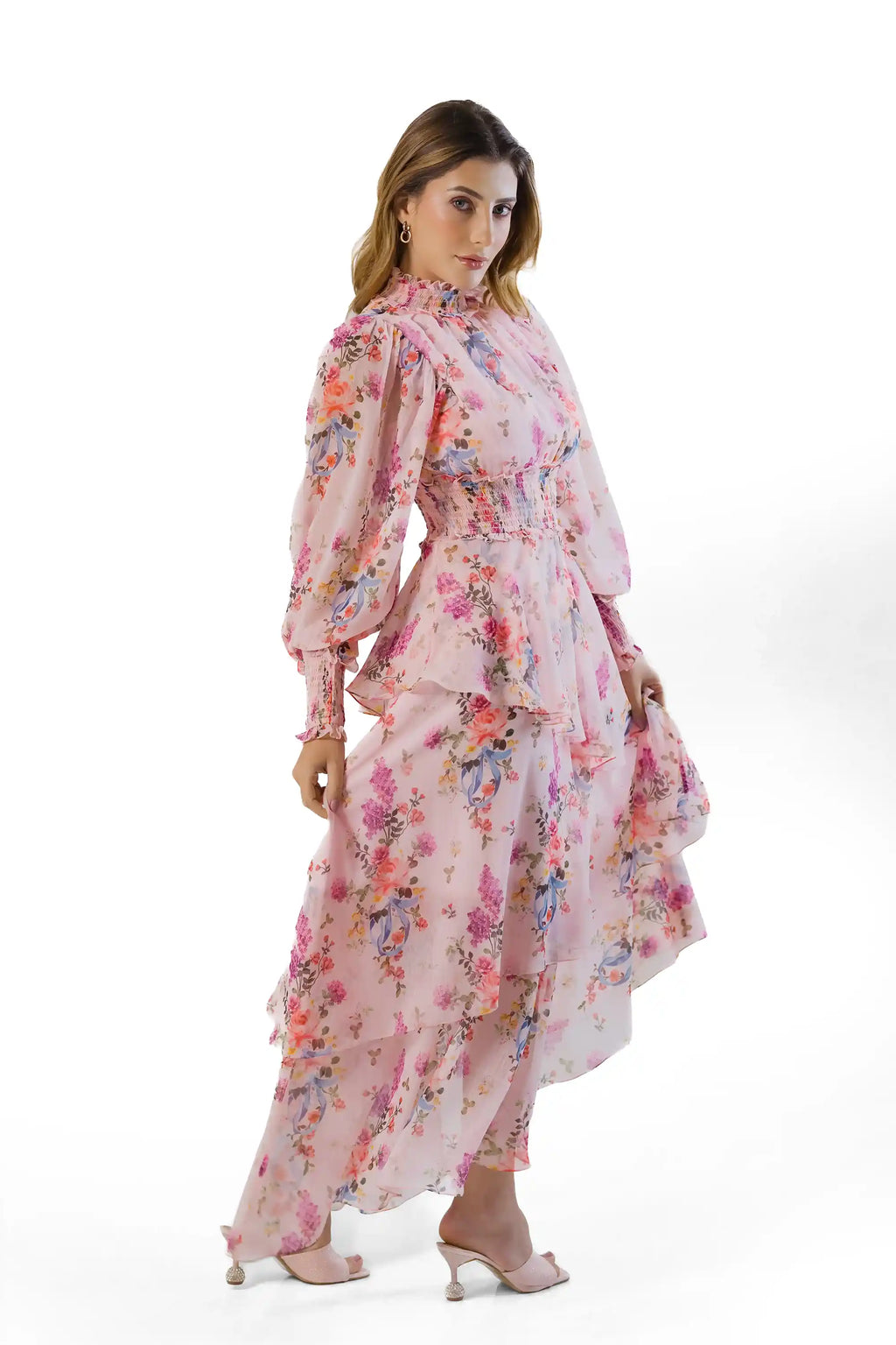 Side angle view: pink floral high-neck tiered maxi with asymmetric tiers