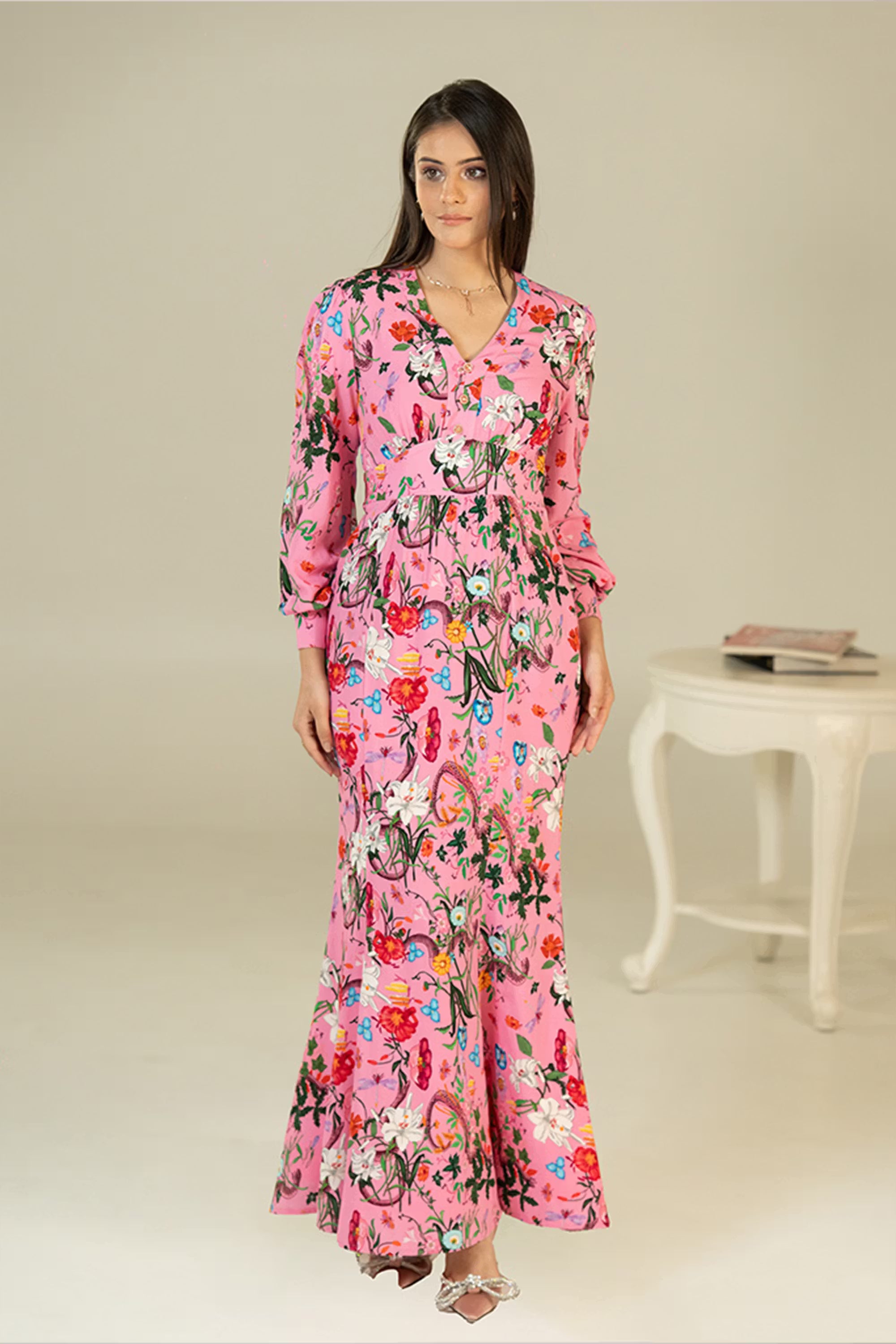 Front closeup of women’s pink floral maxi dress with V-neck and long sleeves