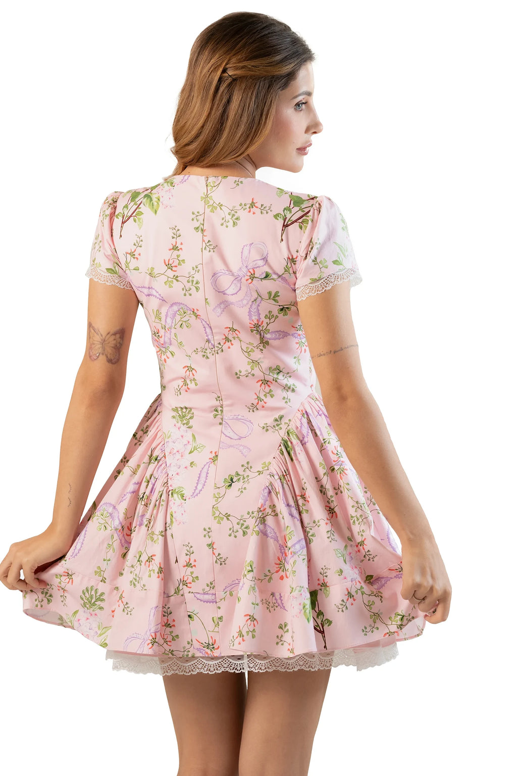 Back view: pink floral short-sleeve mini dress with lace hem and gathers