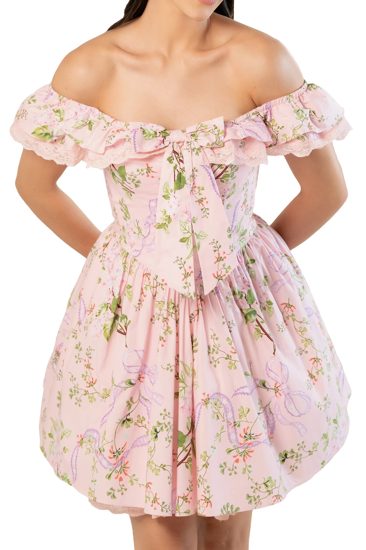 Front view of pink floral off-shoulder mini dress with statement bow, lace ruffle and gathered fit-and-flare waist