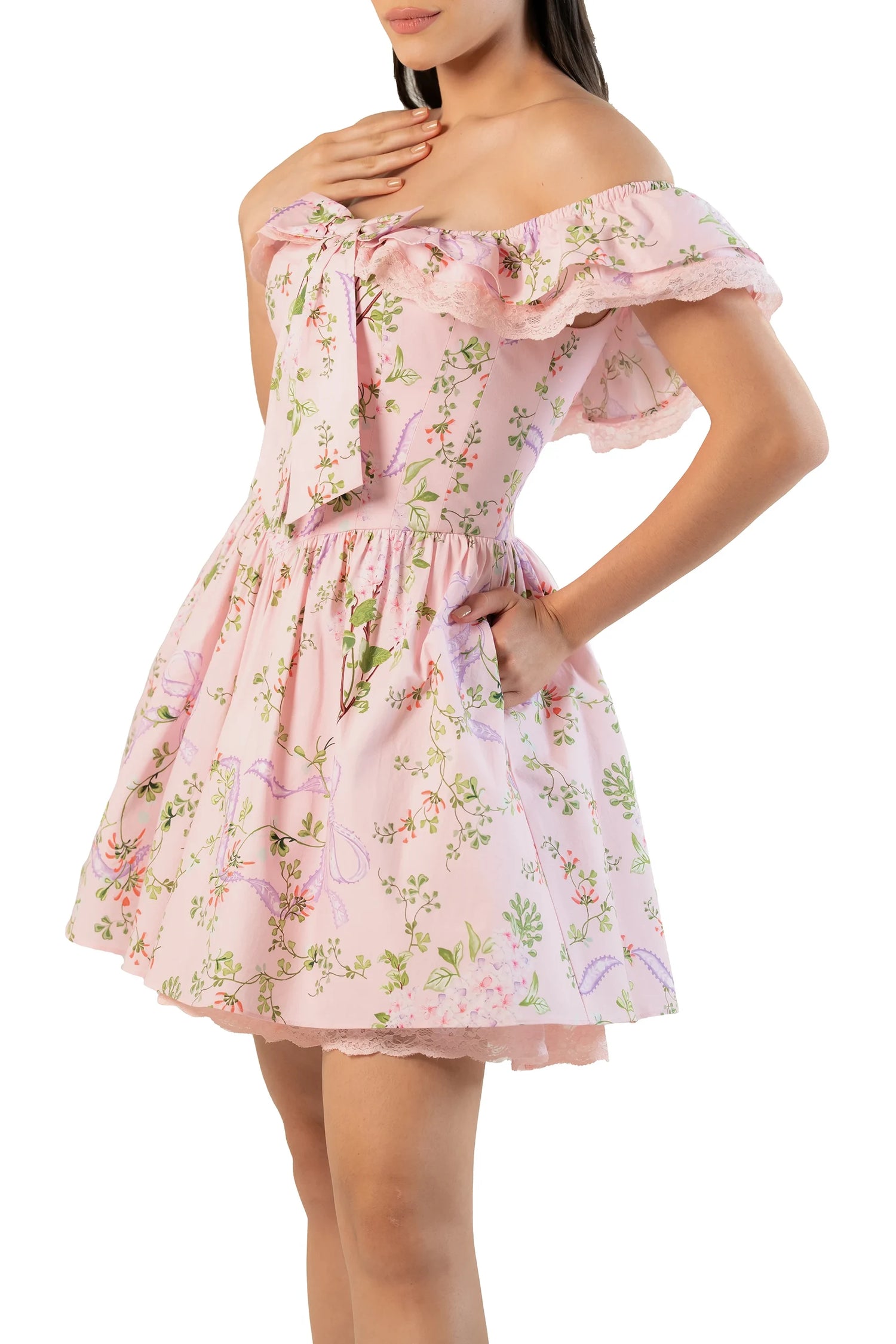 Women’s pink floral off-shoulder mini dress with ruffled lace neckline, statement bow and pockets — side view