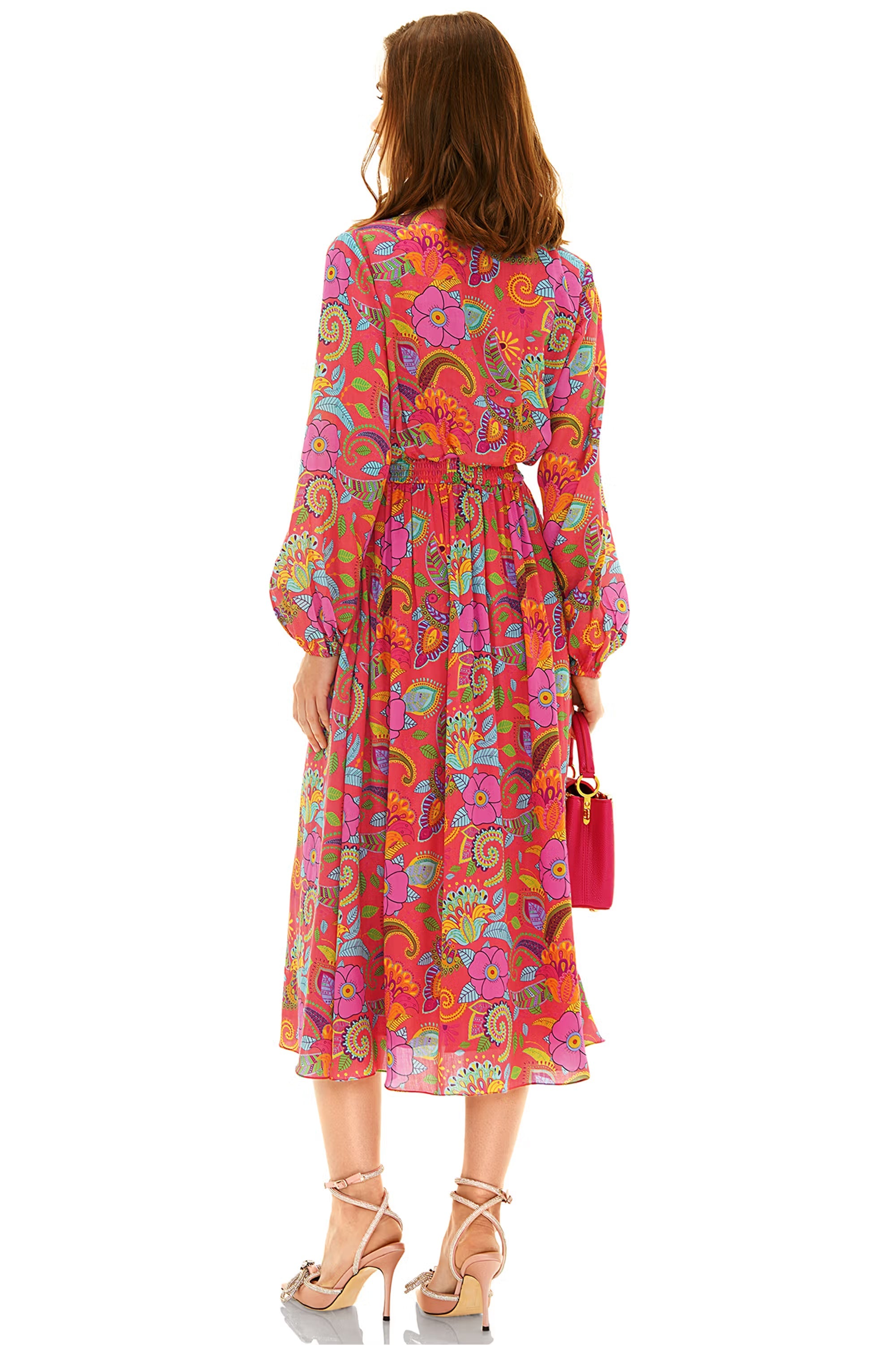 Back view of pink floral paisley midi dress with flowy hem and long sleeves