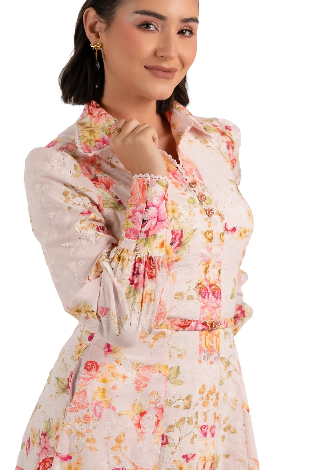 Close-up of pink floral print collared mini dress with buttons and belt