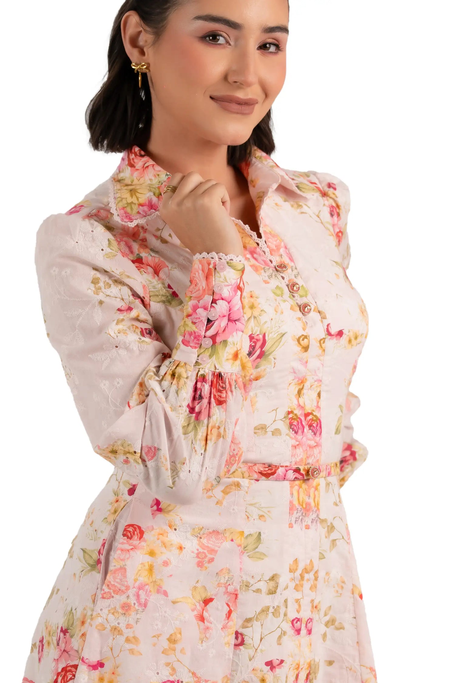 Close-up of pink floral print collared mini dress with buttons and belt