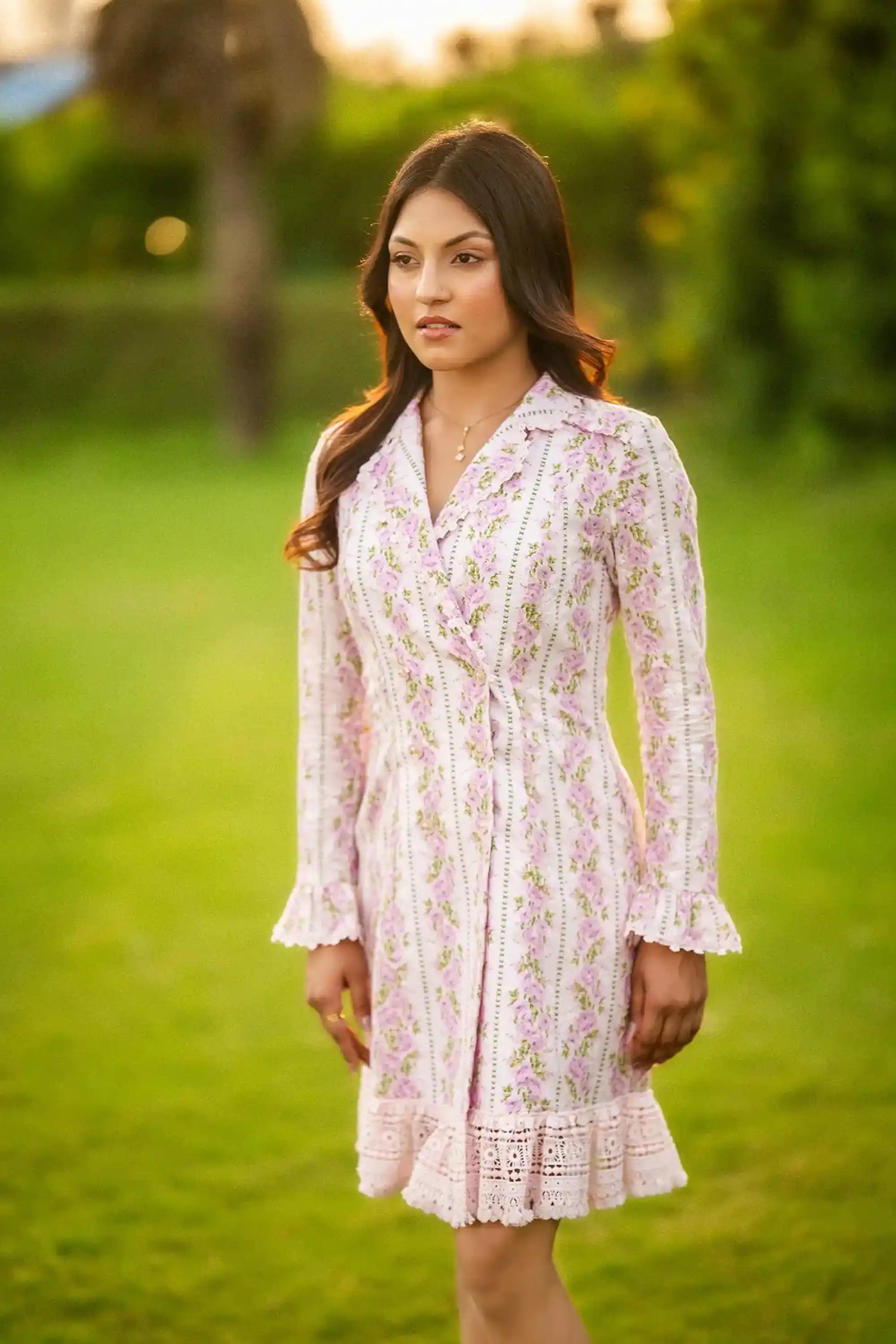 Front detail of white mini dress with pink rose floral prints