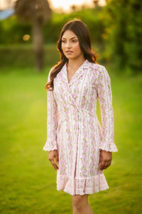 Front detail of white mini dress with pink rose floral prints