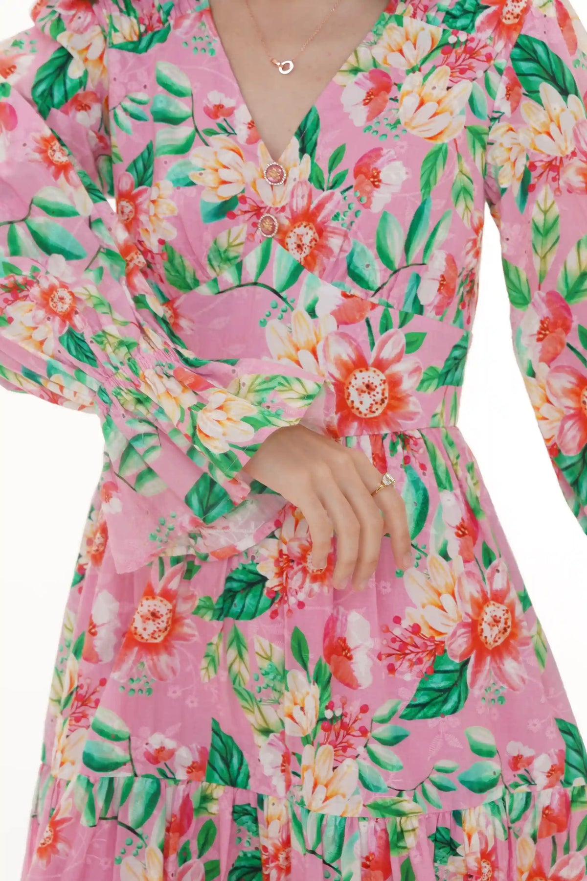 Close-up of Pretty Pixie pink floral puff-sleeve mini dress