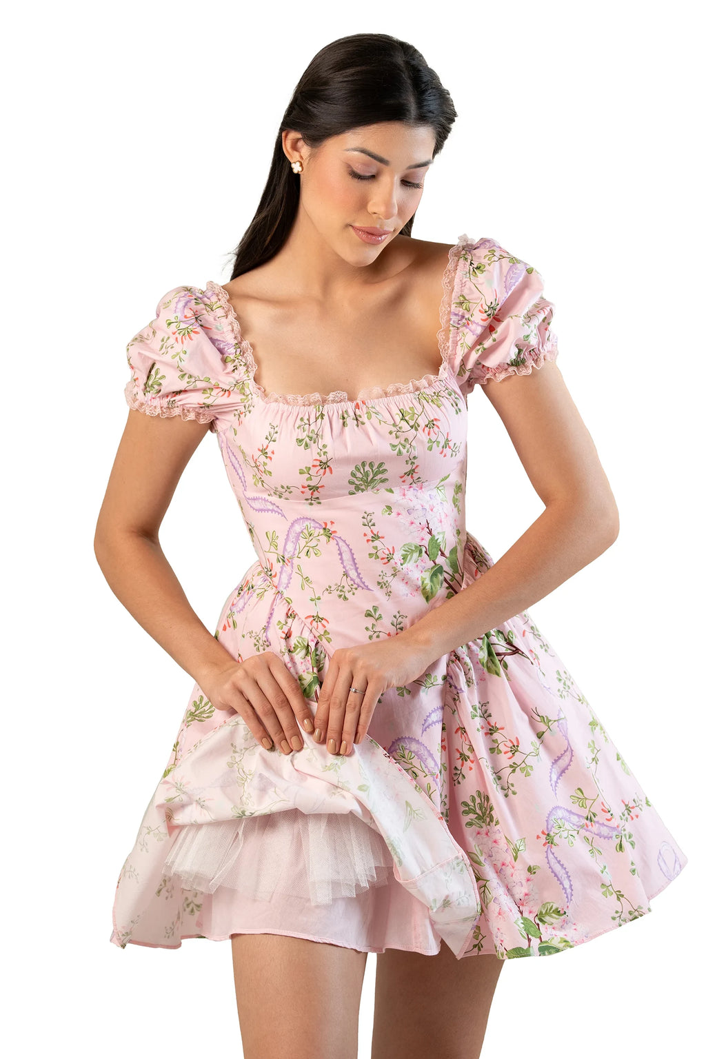 Model in pink floral puff-sleeve mini dress with square neckline, lace trim, and tulle-lined skirt.