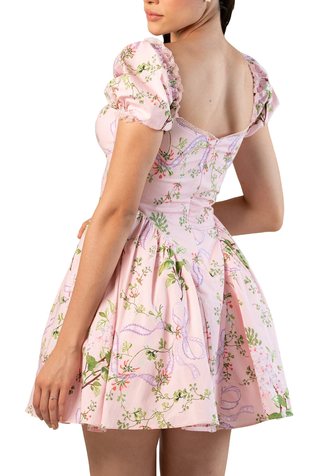 Back angle close-up: pink floral puff-sleeve mini with scooped back