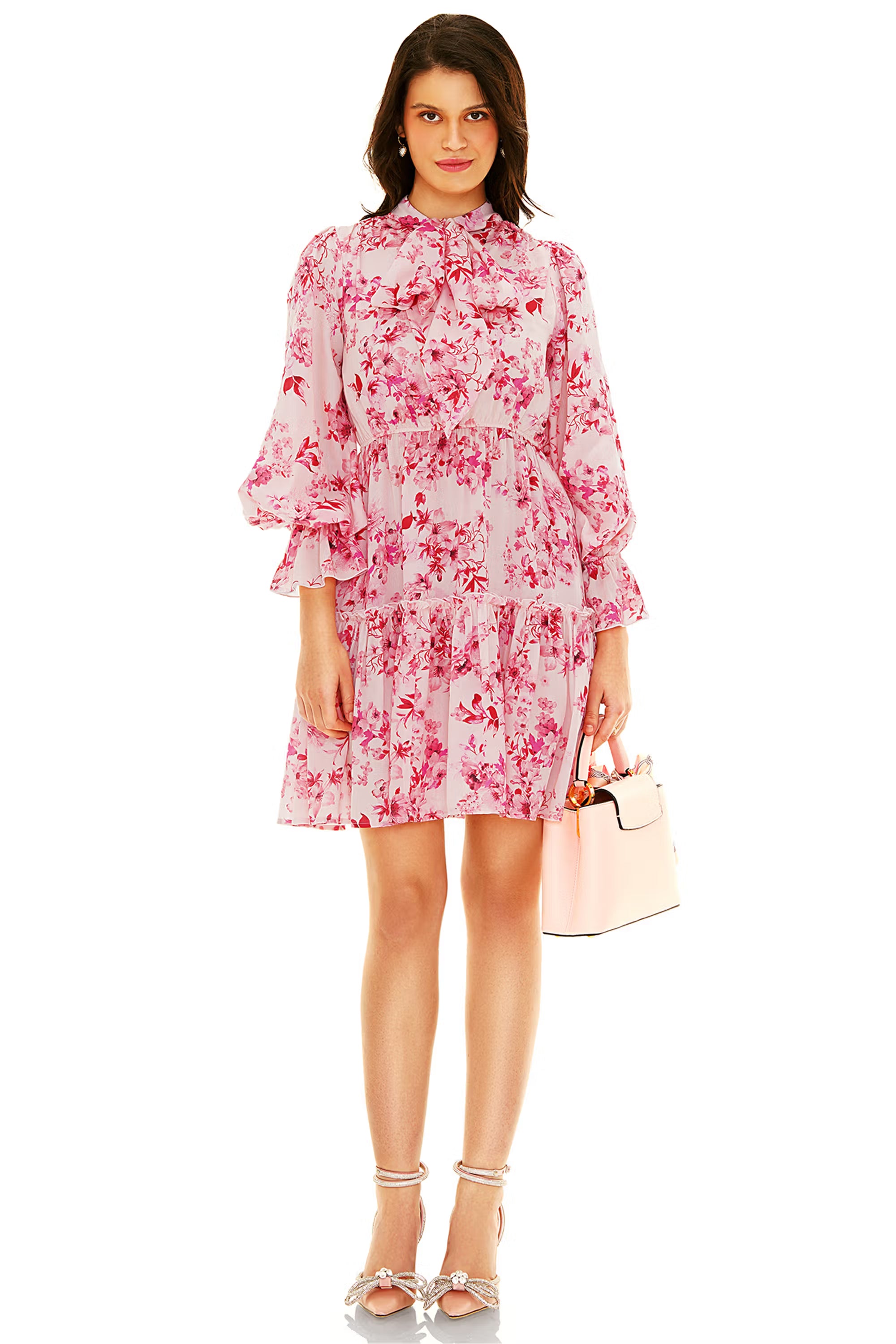 Front view of pink floral ruffle mini dress with bow tie neck and layered hem, perfect spring outfit