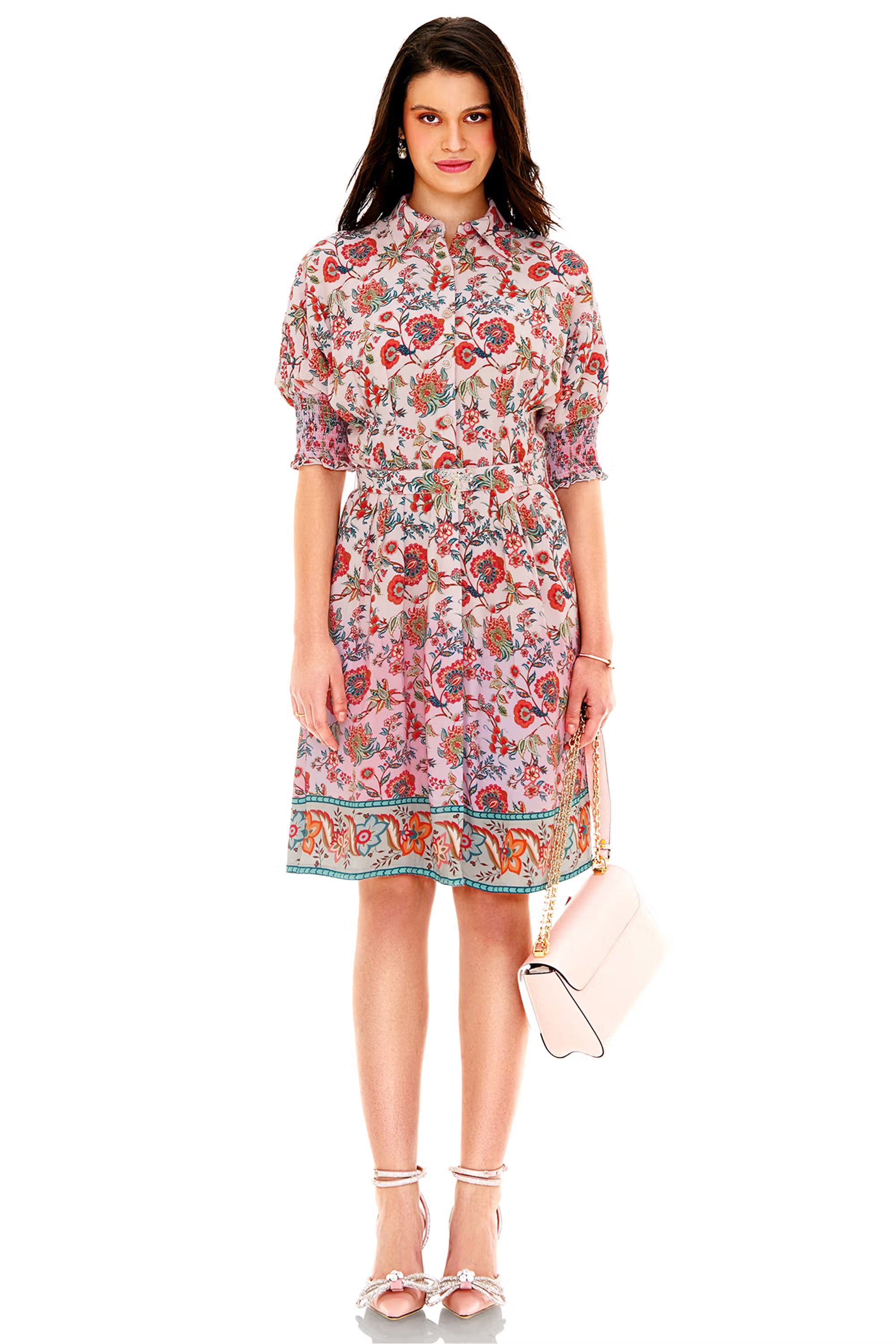 Pink floral shirt-style knee-length dress with smocked sleeves and belted waist, front view
