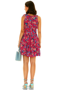 Back view of sleeveless pink floral mini dress with waist tie, casual summer wear
