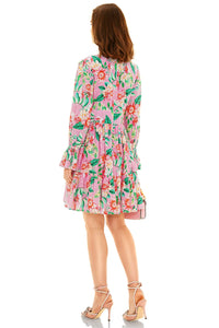 Back view of pink floral V-neck mini dress with long sleeves and tiered design