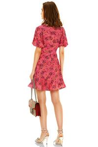 Back view of pink floral V-neck short dress with puff sleeves, lightweight fabric
