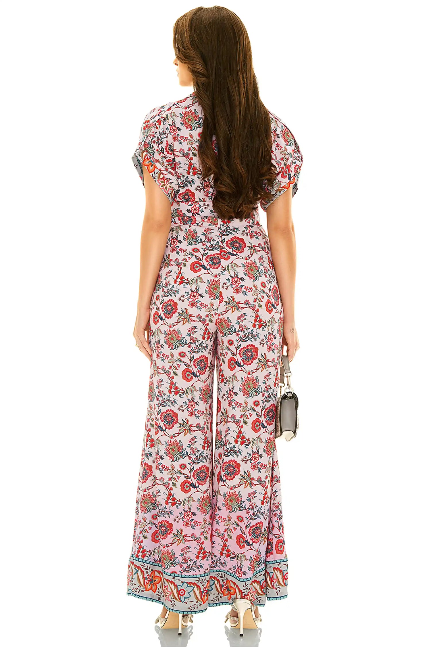 Back view of pink floral v-neck wide-leg jumpsuit in lightweight fabric