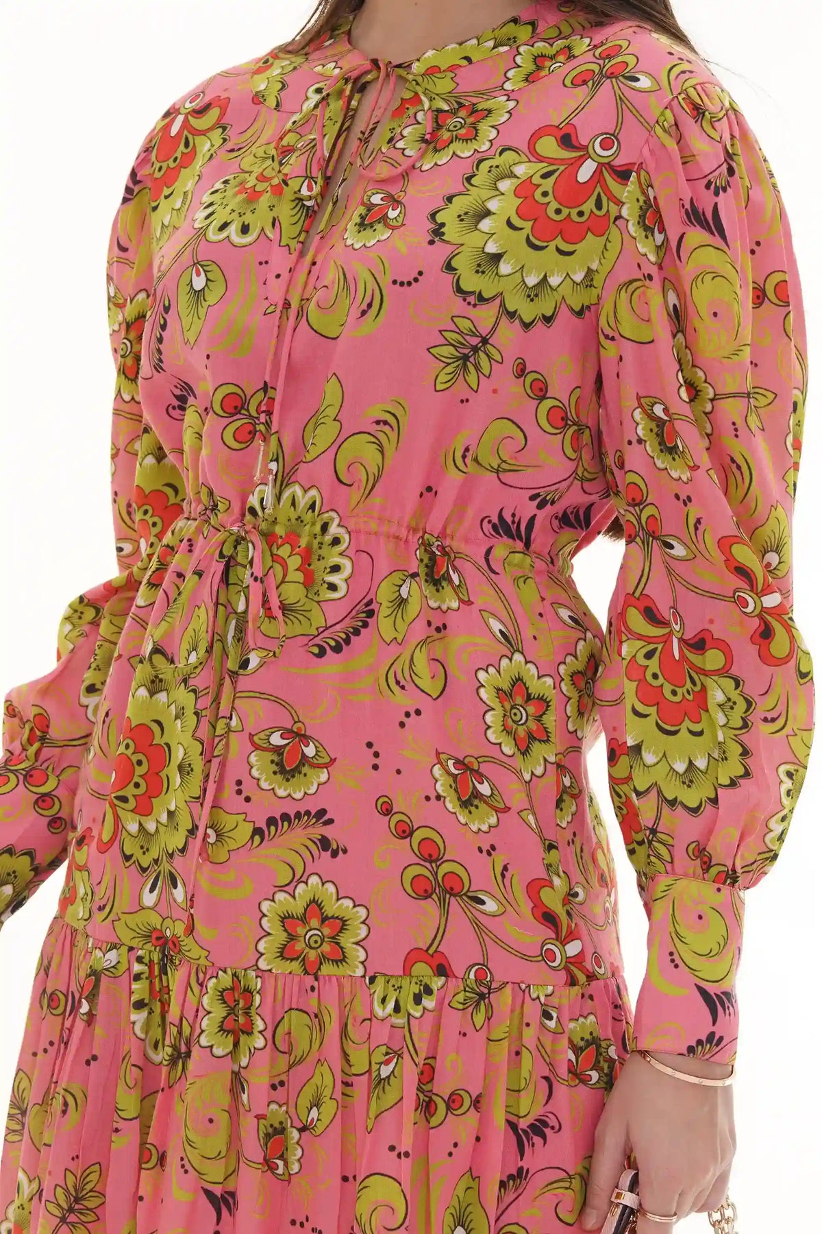 Close-up of Pretty Pixie pink and green floral tie-neck tiered dress, drawstring waist detail