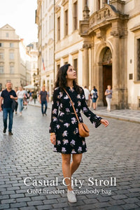 Woman in Pretty Pixie midnight iris floral belted long-sleeve mini dress styled for a casual city stroll