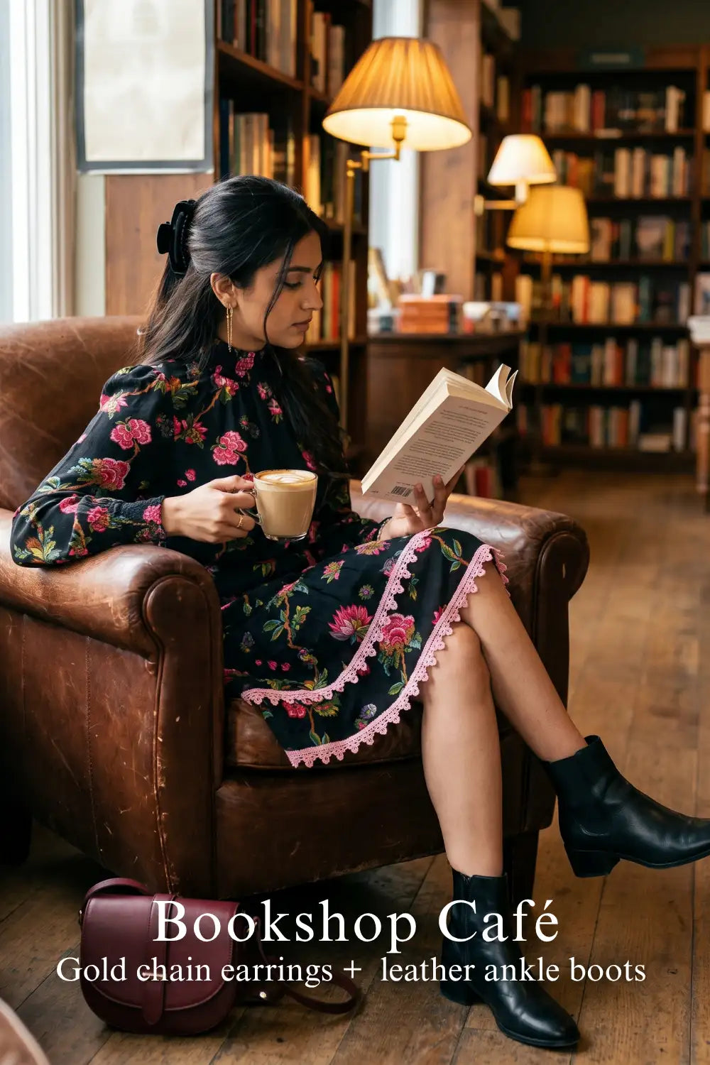 Woman in Pretty Pixie noir floral high-neck puff-sleeve mini dress styled for a bookshop cafe