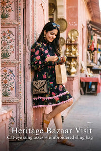 Woman in Pretty Pixie noir floral high-neck puff-sleeve mini dress styled for a heritage bazaar visit
