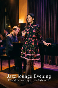Woman in Pretty Pixie noir floral high-neck puff-sleeve mini dress styled for a jazz lounge evening