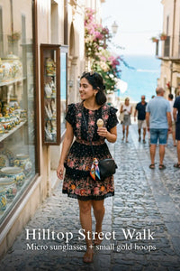 Pretty Pixie black floral smocked waist ruffle dress for hilltop street walk.