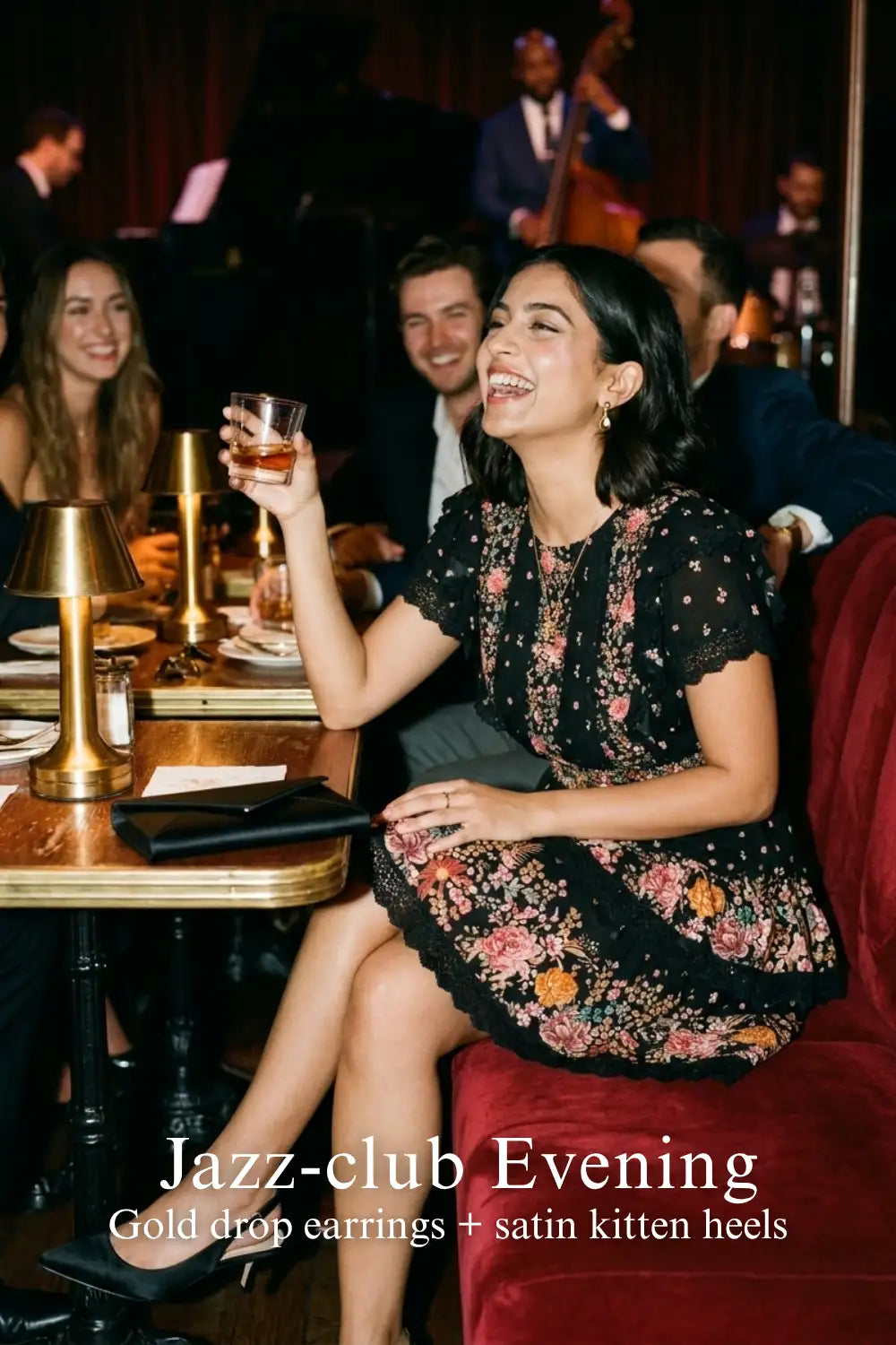 Pretty Pixie black floral smocked waist ruffle mini dress for jazz club evening.